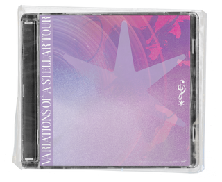 A shrink-wrapped CD jewel case. The cover art is a grainy purple-to-pink gradient with a large pale six-pointed star, the album title running vertically up the left edge, and a small treble-clef-and-star mark.