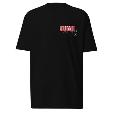 A black tee with an off centered graphic to the left side of the sweatshirt. The design features the word 'THYME' in a large, white font layered over a red rectangle accompanied by red text depicting "FIELD" underneath it.