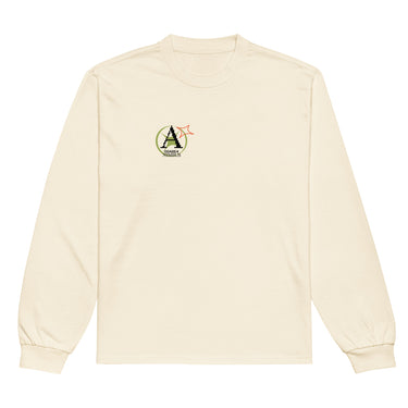 Front view of a solid-colored longsleeve. A small graphic on the left chest features a circular emblem containing a large, pixel-art style letter 'A'. A small, outlined star symbol is next to the emblem.