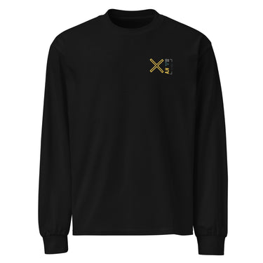 Front view of a solid-colored, longsleeve. A small graphic on the left chest features a large, high-contrast 'X' symbol next to a small, vertical block of text and code-like characters.