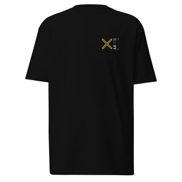 Front view of a solid-colored, shirt. A small graphic on the left chest features a large, high-contrast 'X' symbol next to a small, vertical block of text and code-like characters.
