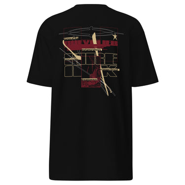 Back view of a solid-colored, shirt. A large collage graphic is centered on the back, dominated by large, overlapping, outline-style typography. The design is layered with rectangular blocks, fine sketchy lines, and multiple smaller blocks of text, creating a deconstructed, schematic look. Featured text includes “Fire” “Atk” “Chevalier” “Dance of fire” “Dreamweave” amongst other phrases.