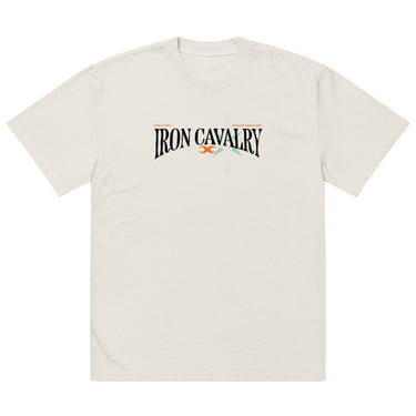 Front view of a solid-colored oversized-tee. A graphic centered on the chest features the words "IRON CAVALRY" in an elegant, arched serif font, with a small icon of two mirrored axe heads in the center.