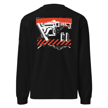 Back view of a solid-colored longsleeve. A large graphic on the upper back features a detailed, high-contrast illustration of a futuristic nailgun. The design includes diagonal hazard stripes and schematic-style text and symbols emulating a blueprint.