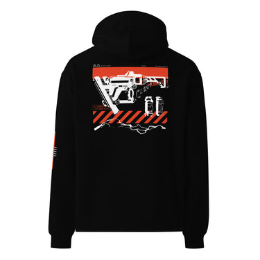 Back view of a solid-colored oversized-hoodie. A large graphic on the upper back features a detailed, high-contrast illustration of a futuristic nailgun. The design includes diagonal hazard stripes and schematic-style text and symbols emulating a blueprint.