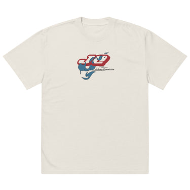 Front view of a solid-colored oversized-tee. A graphic on the chest features the characters "JQ" in a stylized, high-contrast font, intertwined with a flowing, smoke-like shape. Below is the text "Alchemy Commission".