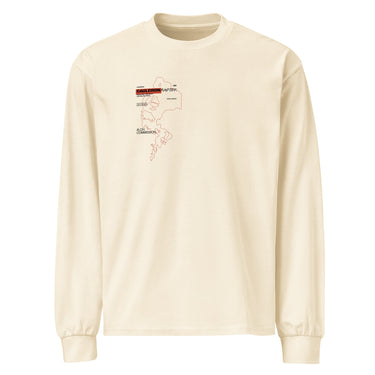 Front view of a solid-colored longsleeve. A small graphic on the left chest features a fine-line illustration resembling a smoke outline, with several blocks of technical-style text labeling different areas.