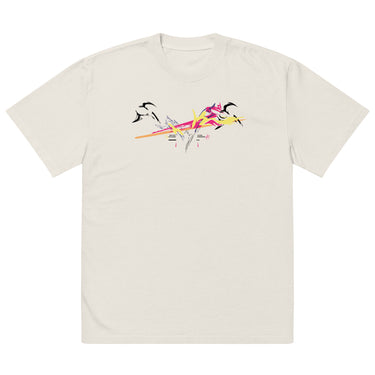Front view of a solid-colored oversized-tee. A large, dynamic graphic across the chest features a chaotic collage of high-contrast brush strokes, sharp angular forms, and silhouettes resembling swooping birds.