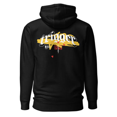 Back view of a solid-colored, hoodie. A large, horizontal graphic on the upper back features the word "trigger" in a high-contrast, graffiti, streetwear-style font. This is layered over a wide brushstroke shape and several smaller text elements, including a barcode and a cross symbol.