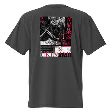 Back view of the oversized-tee showing a large, poster-style graphic. The design is a collage featuring a black and white photo of a Japanese temple roof, with vertical red Kanji on the right and the word 'UKINAMI' in red below.