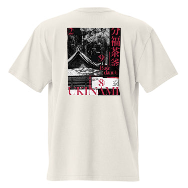 Back view of the oversized-tee showing a large, poster-style graphic. The design is a collage featuring a black and white photo of a Japanese temple roof, with vertical red Kanji on the right and the word 'UKINAMI' in red below.