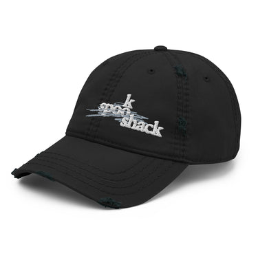 3/4 view of an distressed hat in black. The embroidered logo "spook shack" is shown on the front panel, designed with a stylized font and layered over abstract horizontal brush strokes.