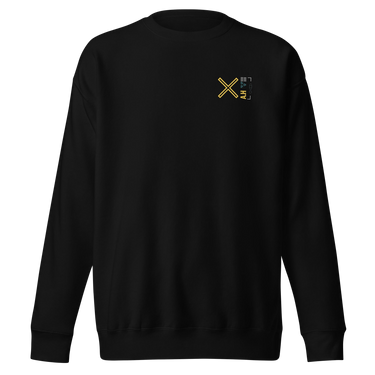 Front view of a solid-colored, sweatshirt. A small graphic on the left chest features a large, high-contrast 'X' symbol next to a small, vertical block of text and code-like characters.