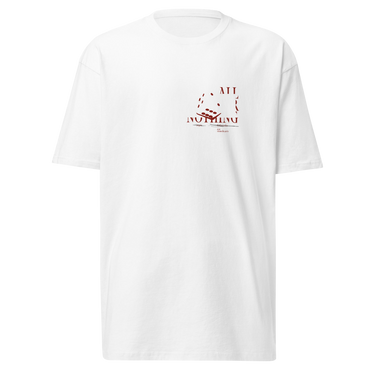 Front view of a solid-colored shirt. A small graphic on the left chest features the text "ALL OR NOTHING" in a fragmented font, combined with high-contrast illustrations of tumbling dice.