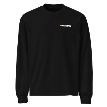 Front view of an longsleeve in black. A minimalist design is placed on the upper left chest, featuring a compact arrangement of graphic elements. The word “KRAMPUS” appears in small white uppercase lettering, paired with a circular gold icon to its left.