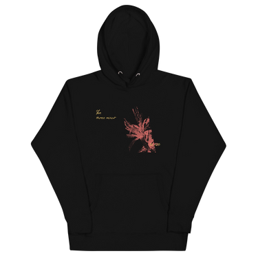 Front view of a solid-colored hoodie. A graphic on the chest features a large, abstract, high-contrast shape resembling a flower, accompanied by several lines of handwritten-style script.