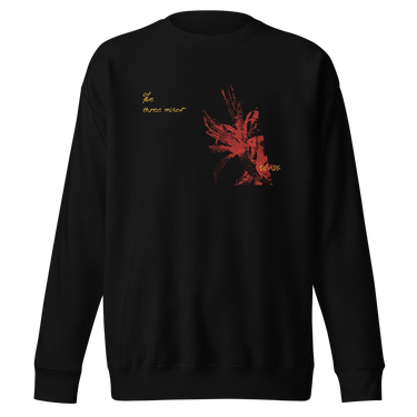 Front view of a solid-colored sweatshirt. A graphic on the chest features a large, abstract, high-contrast shape resembling a flower, accompanied by several lines of handwritten-style script.