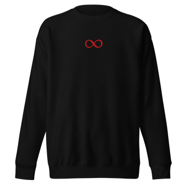 Front view of a sweatshirt in black. A small red infinity-loop motif sits at the center chest as the only graphic — minimalist and restrained, with bold color contrast against the dark fabric.
