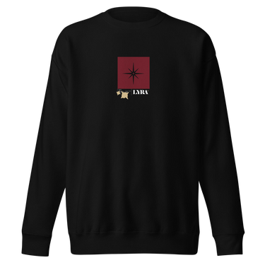 Front view of a solid-colored, sweatshirt. A small graphic is centered on the chest, featuring a solid vertical rectangle containing a four-pointed star. The word "LYRA" is next to it, and two small charm-like shapes hang from the bottom.