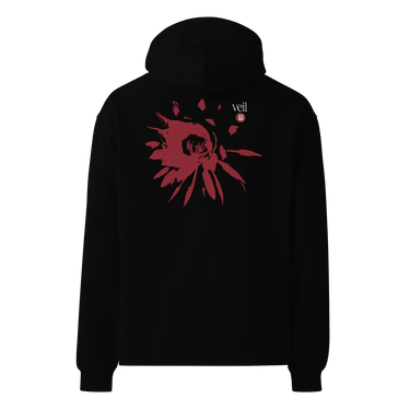 Back view of an oversized hoodie in black. HSR Evernight inspired design shows a large abstract red flower graphic in the center. Above the flower, text reads “veil” with a red circular stamp containing a chinese character.