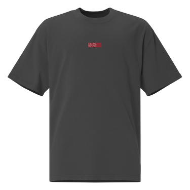 Front view of an oversized tee in black. Design is a small, embroidered red patch on the left chest featuring the white line art of an Astral Express ticket from Honkai: Star Rail.