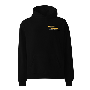 Front view of an oversized hoodie in black. Design is positioned on the upper left chest. Design features a yellow rectangular label reading “CONNECKEN,” smaller text “DER WÄCHTER,” and fine white script lines and coordinates below it.