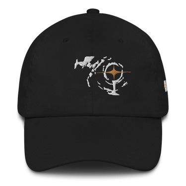 Front view of a Baseball Cap in Black. an embroidered emblem on the crown showing a jagged white constellation-like shape encircling a small orange starburst at its center, evoking a compass or astrolabe