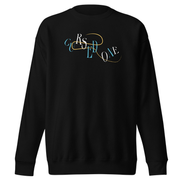 Front view of a solid-colored sweatshirt. A graphic on the chest features the letters spelling "CURSED ONE" scattered and layered in a mix of high-contrast fonts, intertwined with a fine swirling line.