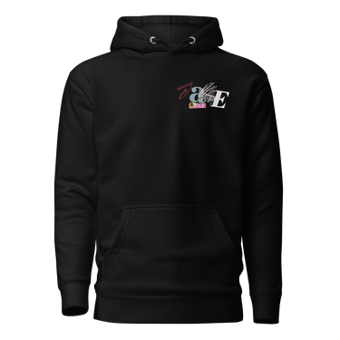 Front view of a solid-colored hoodie. A small collage graphic on the left chest features the letters 'J' and 'E' and a serpent-like ampersand, layered over abstract shapes and sketchy lines that seemingly cover the letters ‘A’ and ‘N’ to form “Jane”.