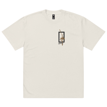 Front view of a solid-colored oversized-tee. A small graphic on the chest features a vertical rectangular frame containing a high-contrast floral illustration and a sword-like shape.