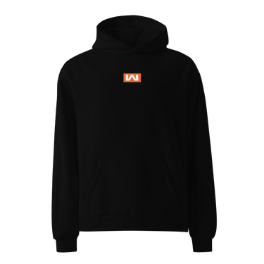 Black oversized hoodie, front view, featuring a small centered orange rectangular logo with a stylized white 'M' inside.