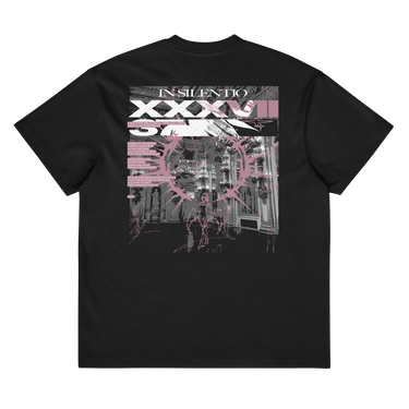 Back view of a box tee in black. A large rectangular back graphic layers an ornate hall interior in high-contrast greyscale beneath oversized roman numerals 'XXXVII' and a serif 'IN SILENTIO' wordmark. Dusty pink text bars carry a short poem down the left edge, cut through by thorned starburst linework in the same pink.