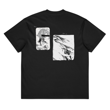 Back view of a box tee in black. A large two-panel composition fills the back. On the left, a halftoned portrait with a solid black bar across the eyes; to the right, a wider panel of sweeping feathers in heavy contrast. The words "pas" and "d'aveu" float above them in a fine serif, the letters spaced apart and drifting.