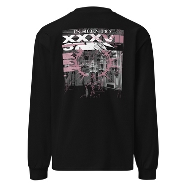Back view of a longsleeve in black. A large rectangular back graphic layers an ornate hall interior in high-contrast greyscale beneath oversized roman numerals 'XXXVII' and a serif 'IN SILENTIO' wordmark. Dusty pink text bars carry a short poem down the left edge, cut through by thorned starburst linework in the same pink.