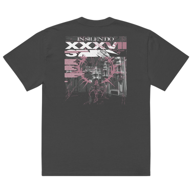 Back view of an oversized tee in faded black. A large rectangular back graphic layers an ornate hall interior in high-contrast greyscale beneath oversized roman numerals 'XXXVII' and a serif 'IN SILENTIO' wordmark. Dusty pink text bars carry a short poem down the left edge, cut through by thorned starburst linework in the same pink.