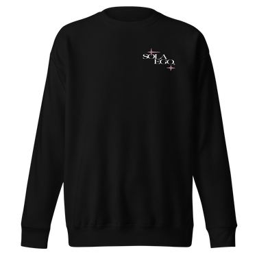 Front view of a sweatshirt in black. A small left-chest graphic reads 'SOLA EGO' in a high-contrast serif, split across two lines, with two four-pointed star accents in dusty pink flanking the type.