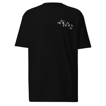 Front view of a t-shirt in black. A small left-chest graphic reads 'SOLA EGO' in a high-contrast serif, split across two lines, with two four-pointed star accents in dusty pink flanking the type.