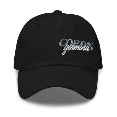 Front view of an baseball cap in black. Design is with embroidered text centered above the brim. The stitching combines serif and script styles, reading “Cordis Germina.”