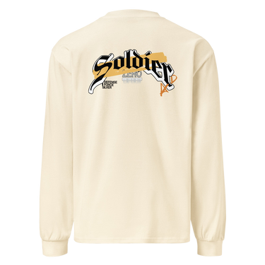 Back view of a solid-colored, longsleeve. A large, horizontal graphic on the upper back features the word "Soldier" in a high-contrast, stylized script font. This is layered over a wide brushstroke shape and several smaller blocks of text, and san serif text featuring the word “Zero”
