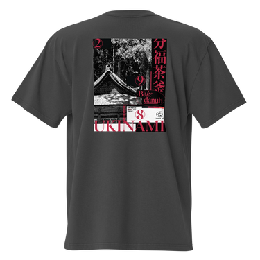 Back view of the oversized-tee showing a large, poster-style graphic. The design is a collage featuring a black and white photo of a Japanese temple roof, with vertical red Kanji on the right and the word 'UKINAMI' in red below.