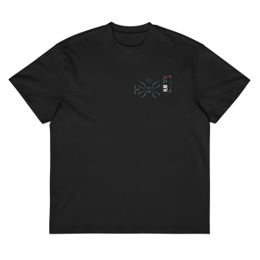 Front view of a box tee in black, flat. A small graphic on the left chest features a geometric, flower-like symbol made of fine lines, next to a vertical block of technical-style text.