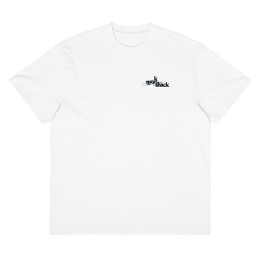 Front view of a box tee in white, flat. Design features a small logo on the upper chest featuring the words "spook shack" in a stacked, stylized font, with abstract horizontal brush strokes layered behind the text.