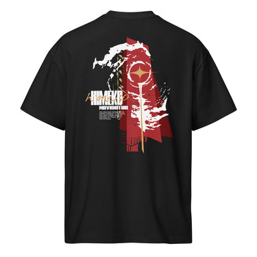 Back view of a Box Tee in Black. a large back graphic centered on a jagged, torn-map style emblem in white with a glowing star burst at its center, layered over angled orange-red geometric panels resembling sail or flag fragments, alongside a bold two-line wordmark, a short block of descriptive text, and a smaller diagonal wordmark near the hem