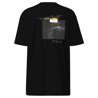 Back view of an t-shirt in black. Design shows a rectangular grayscale graphic centered on the upper back showing a lighthouse shining into darkness. Above the image is a yellow label reading “LIGHTKEEPER,” surrounded by thin white grid lines and handwritten script text for a technical, conceptual design aesthetic