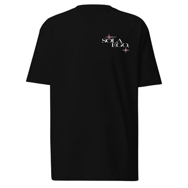 Front view of a t-shirt in black. A small left-chest graphic reads 'SOLA EGO' in a high-contrast serif, split across two lines, with two four-pointed star accents in dusty pink flanking the type.