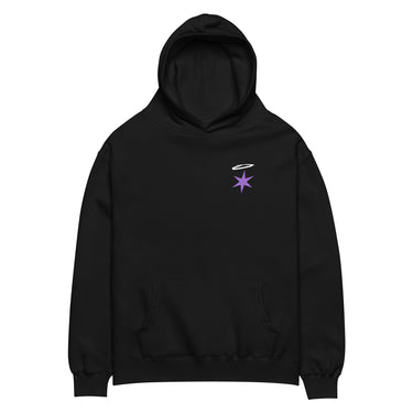 Front view of an oversized hoodie in black. A small graphic sits high on the left chest: a loose, hand-drawn halo ring in white tilted above a sharp six-pointed star in soft violet. Both shapes print flat, the ring's brushed edges left rough and unfinished.