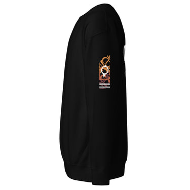 A view of the sleeve of a sweatshirt, showing a vertical graphic block filled with abstract, high-contrast patterns and symbols.