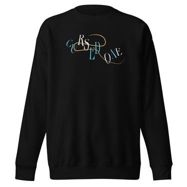 Front view of a solid-colored sweatshirt. A graphic on the chest features the letters spelling "CURSED ONE" scattered and layered in a mix of high-contrast fonts, intertwined with a fine swirling line.