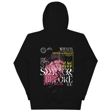 Back view of a solid-colored hoodie. A large, complex collage graphic on the upper back features the text "THE STARS SHATTER BEFORE YOU" in a distressed style. The design is layered with abstract textures, barcodes, wireframe globes, and a web of lines creating a shattered glass effect.