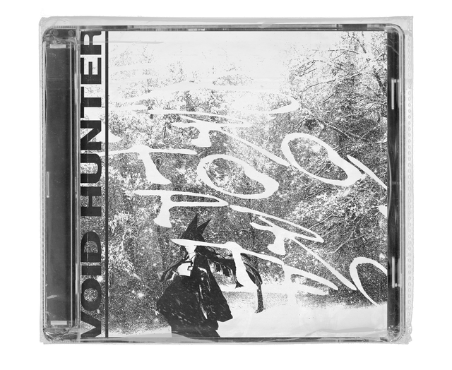 CD jewel case in clear shrink wrap. The cover is a grainy black-and-white photograph of a snowy forest with a small dark figure with pointed ears, overlaid with large white brush script, and bold vertical black lettering down the left edge.